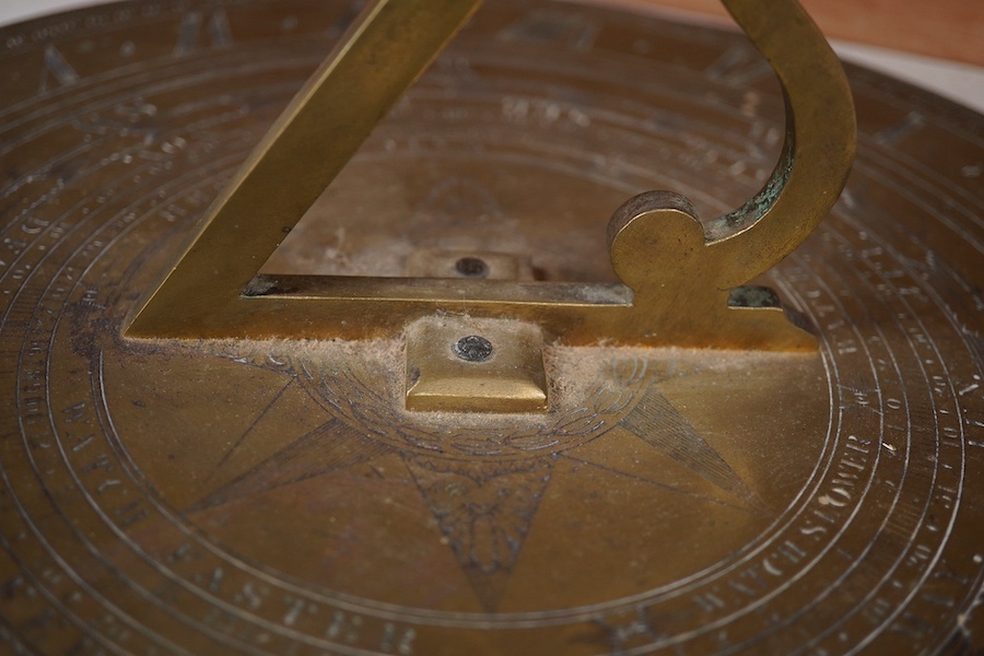 An early Victorian Adie & Son bronze sun dial, engraved; Edinburgh 1842, 32cm diameter, 19cm to end of gnomon. Condition - fair to good.